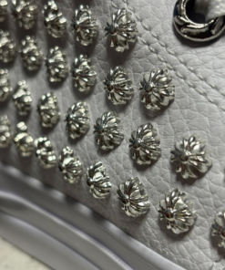 Alternative view of All-white Converse with studs on the sides