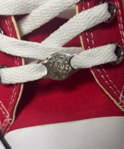 Alternative view of Red Converse shoes with leopard print and white and black patterns on the upper.