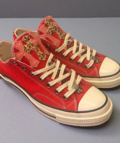 Alternative view of Red Converse shoes with pink and leopard print cross decorations.