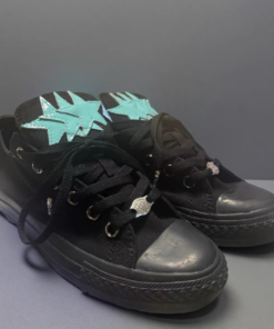 Black Converse shoes with blue star pattern