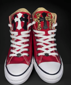 Red Converse shoes with leopard print and white and black patterns on the upper.