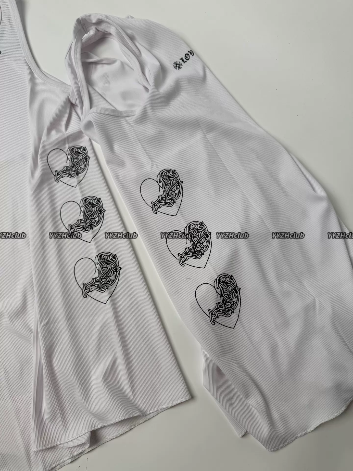 Alternative view of ChromeHearts heart-shaped vine design, white waffle vest with slogan on the chest